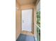 Private entrance with a white door and a small balcony at 2156 Masters Ct # 2156, Dunedin, FL 34698