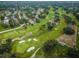 Aerial view of golf course and surrounding neighborhood at 2156 Masters Ct # 2156, Dunedin, FL 34698