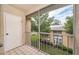 Screened balcony overlooking the lush green landscape at 2156 Masters Ct # 2156, Dunedin, FL 34698