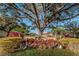 St Andrews Links community entrance, featuring landscaping and an American flag at 2156 Masters Ct # 2156, Dunedin, FL 34698