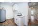 Updated laundry room with white cabinets and new flooring at 2156 Masters Ct # 2156, Dunedin, FL 34698