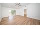 Bright bedroom with laminate wood flooring and ceiling fan at 2156 Masters Ct # 2156, Dunedin, FL 34698