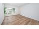 Bright living room with light wood flooring at 2156 Masters Ct # 2156, Dunedin, FL 34698