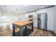 Modern kitchen with island and stainless steel appliances at 2156 Masters Ct # 2156, Dunedin, FL 34698