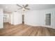 Bright bedroom with wood-look flooring and access to bathroom at 2156 Masters Ct # 2156, Dunedin, FL 34698