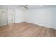 Large bedroom with light walls and wood-look flooring at 2156 Masters Ct # 2156, Dunedin, FL 34698