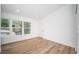 Spacious bedroom with large windows and a view of the lush surroundings at 2156 Masters Ct # 2156, Dunedin, FL 34698