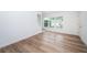 Bright and airy living room with wood-look floors at 2156 Masters Ct # 2156, Dunedin, FL 34698