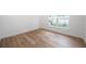 Bright bedroom with wood-look flooring at 2156 Masters Ct # 2156, Dunedin, FL 34698