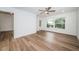 Spacious bedroom, featuring laminate flooring and ceiling fan at 2156 Masters Ct # 2156, Dunedin, FL 34698