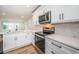 Modern white kitchen with stainless steel appliances at 2156 Masters Ct # 2156, Dunedin, FL 34698
