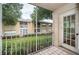 Screened balcony overlooks a courtyard with lush landscaping at 2156 Masters Ct # 2156, Dunedin, FL 34698