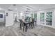 Open concept dining room with access to the kitchen and backyard at 768 Pinellas Point S Dr, St Petersburg, FL 33705