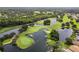 Aerial view of a golf course community with lakes at 1429 Monte Lake Dr, Valrico, FL 33596