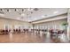 Spacious community room with ample seating and hardwood floors at 13235 Meadow Golf Ave, Hudson, FL 34669