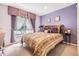 Bright bedroom with double bed and decorative pillows at 13235 Meadow Golf Ave, Hudson, FL 34669