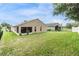 Large backyard with grassy lawn at 13235 Meadow Golf Ave, Hudson, FL 34669