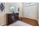 Bright entryway with hardwood floors and decorative accents at 13235 Meadow Golf Ave, Hudson, FL 34669