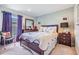 Well-lit bedroom with double bed and dark wood furniture at 13235 Meadow Golf Ave, Hudson, FL 34669