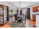 Casual dining area with glass table and four chairs at 13235 Meadow Golf Ave, Hudson, FL 34669