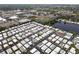 Mobile home community by a lake, with access to recreational facilities, and blue sports field nearby at 12501 Ulmerton Rd # 131, Largo, FL 33774