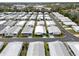 An aerial view showcases the mobile home community's well-maintained streets and matching homes at 12501 Ulmerton Rd # 131, Largo, FL 33774