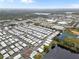 An aerial view displays an expansive mobile home community set alongside a large lake at 12501 Ulmerton Rd # 131, Largo, FL 33774