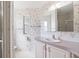 Bathroom featuring decorative wallpaper, vanity, mirror and shower in the background at 12501 Ulmerton Rd # 131, Largo, FL 33774