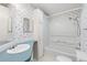Bathroom featuring a vanity, mirror, and a clean, enclosed shower/tub combo at 12501 Ulmerton Rd # 131, Largo, FL 33774
