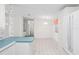 Open-concept layout from the kitchen with updated appliances and connecting dining area at 12501 Ulmerton Rd # 131, Largo, FL 33774