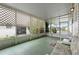 Enclosed patio with views and comfortable seating at 12501 Ulmerton Rd # 131, Largo, FL 33774