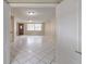 View from doorway into living room with tile floors at 7506 Cumber Dr, New Port Richey, FL 34653