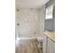 Bathroom with marble-look shower and new fixtures at 8114 N Edison Ave, Tampa, FL 33604