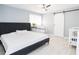 Spacious primary bedroom featuring a king-size bed and barn door at 8114 N Edison Ave, Tampa, FL 33604