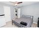 Cozy bedroom with a full-size bed and laundry access at 8114 N Edison Ave, Tampa, FL 33604