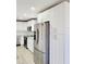 Modern kitchen with white cabinets and stainless steel appliances at 8114 N Edison Ave, Tampa, FL 33604
