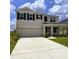 Charming two-story home with a wide driveway, two car garage and well-manicured lawn and landscaping at 8367 Ender Hills Dr, Wesley Chapel, FL 33545