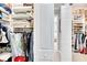 Large walk-in closet with ample shelving and hanging space at 16005 Cape Coral Dr, Wimauma, FL 33598