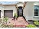 Screened entryway leading to the front door of the home at 16005 Cape Coral Dr, Wimauma, FL 33598