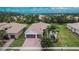 Single-Gathering home with two-car garage and lush landscaping at 16005 Cape Coral Dr, Wimauma, FL 33598