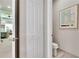 Private bathroom with toilet and a view of bedroom at 16005 Cape Coral Dr, Wimauma, FL 33598