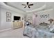 Primary bedroom with a king-size bed, dresser, and calming decor at 16005 Cape Coral Dr, Wimauma, FL 33598
