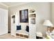 Home office with built-in storage and seating at 16005 Cape Coral Dr, Wimauma, FL 33598