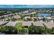 Aerial image of a residential neighborhood near a lake at 16005 Cape Coral Dr, Wimauma, FL 33598