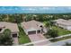 Single-Gathering home with two-car garage and spacious backyard at 16005 Cape Coral Dr, Wimauma, FL 33598