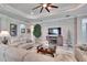 Spacious living area with a fireplace and ample natural light at 16005 Cape Coral Dr, Wimauma, FL 33598