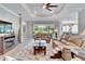 Spacious living room with beige leather furniture and fireplace at 16005 Cape Coral Dr, Wimauma, FL 33598