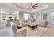 Living room with open concept kitchen and casual seating area at 16005 Cape Coral Dr, Wimauma, FL 33598