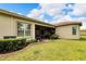 Backyard with screened patio and well-manicured lawn at 16005 Cape Coral Dr, Wimauma, FL 33598