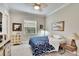 Cozy bedroom with a comfortable bed and ceiling fan at 16005 Cape Coral Dr, Wimauma, FL 33598
